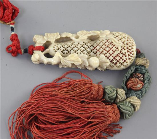 A Chinese ivory perfumier, 18th/19th century, length 7.3cm, suspended with silk cords and tassels